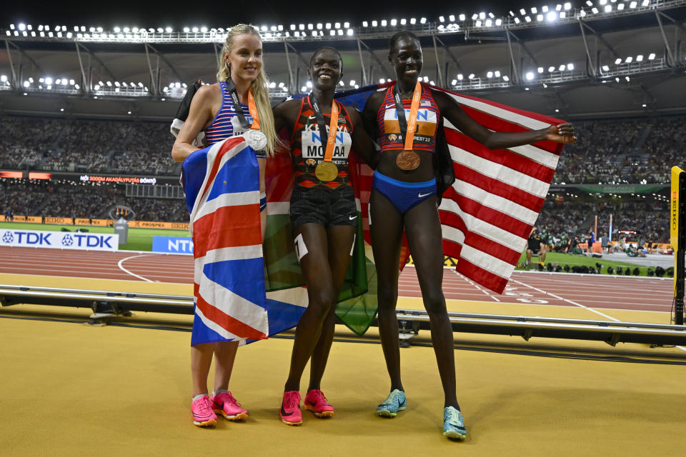 From left: Silver medalist Keely Hodgkinson, of Great Britain, Gold medalist Mary Moraa, of Kenya, and Bronze medalist Athing Mu, of the United States, pose for a picture after the final of the Women's 800-meters during the World Athletics Championships in Budapest, Hungary, Sunday, Aug. 27, 2023. (AP Photo/Denes Erdos)