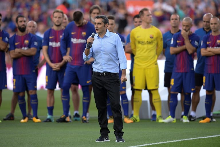 Barcelona's new coach Ernesto Valverde speaks to spectators ahead of a friendly match at the Camp Nou stadium in Barcelona, on August 7, 2017