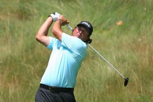 Four-time Major winner Phil Mickelson, pictured on July 6, burst free of a recent form slump with a blistering 64 on day two of the Scottish Open at Castle Stuart on Friday