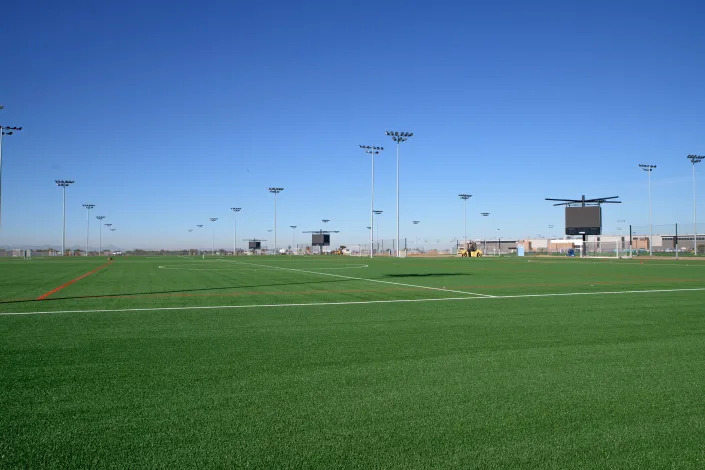 Some of the 35 turf football, soccer and lacrosse fields near end of construction at Bell Bank Park on Dec. 16, 2021. The park is a Legacy sports and entertainment complex that opened January 2022 in Mesa.