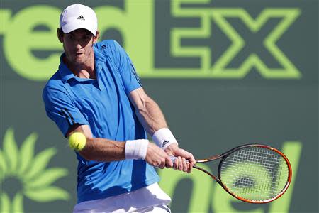 Mar 25, 2014; Miami, FL, USA; Andy Murray hits a backhand against Jo-Wilfried Tsonga (not pictured) on day nine of the Sony Open at Crandon Tennis Center. Geoff Burke-USA TODAY Sports