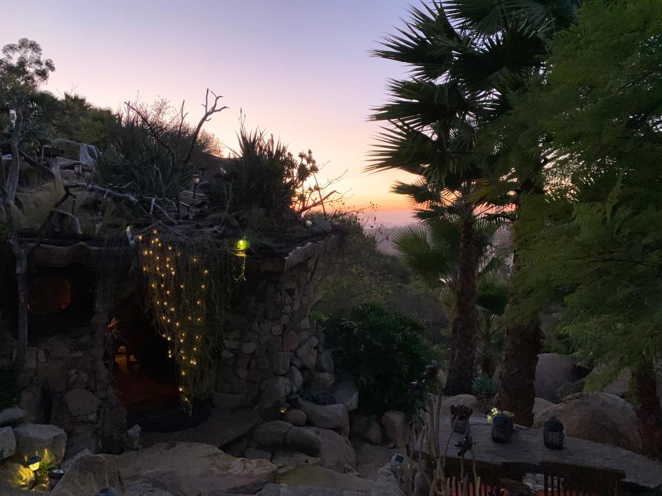 Fiona Chandra, view of the sunset over the Hobbit House, "I paid $412 to Stay in a Hobbit House."
