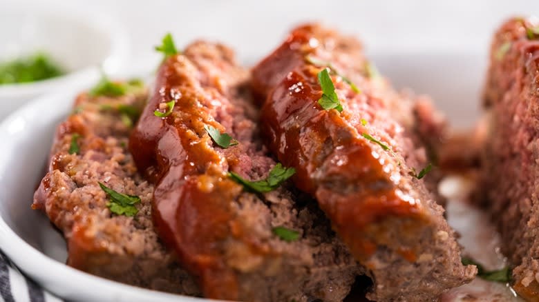 sliced meatloaf with herbs