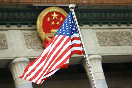 FILE PHOTO: A U.S. flag is seen during a welcoming ceremony in Beijing, China, November 9, 2017. REUTERS/Thomas Peter/File Photo