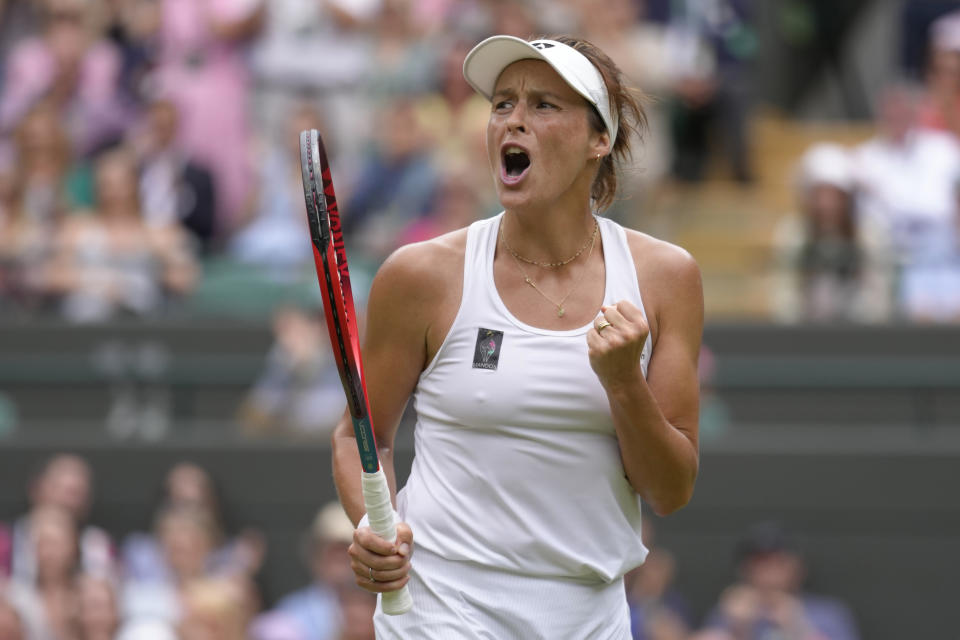 Germany's Tatjana Maria reacts after winning a rally against Germany's Jule Niemeier in a women's singles quarterfinal match at the Wimbledon tennis championships in London, Tuesday July 5, 2022. (AP Photo/Kirsty Wigglesworth)