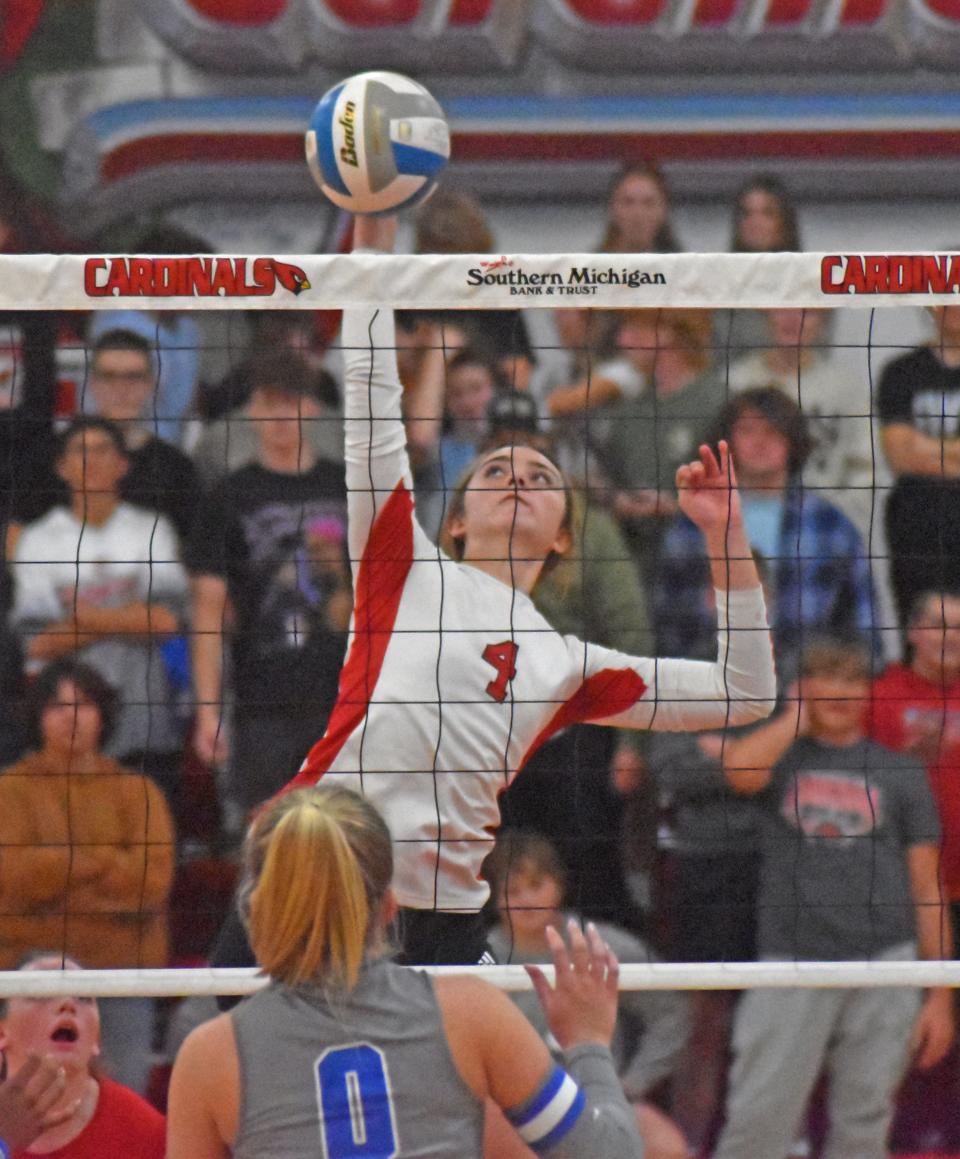 Coldwater's Cece Velazquez (4) skies high for a kill versus Harper Creek on Wednesday