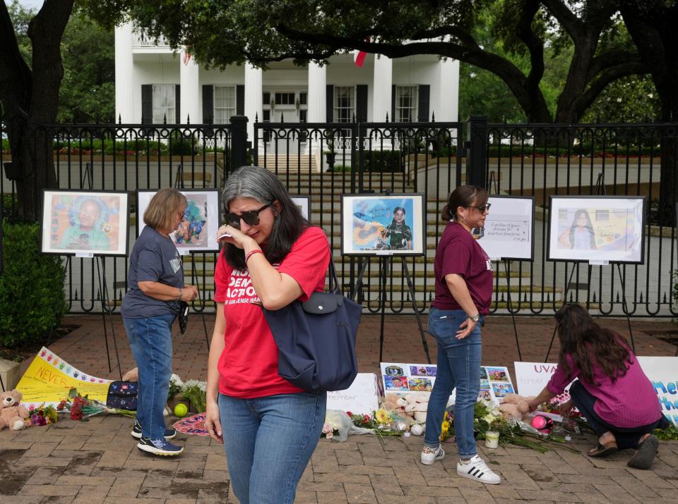 Emily Watson cries at the memorial for the Uvalde shooting victims.