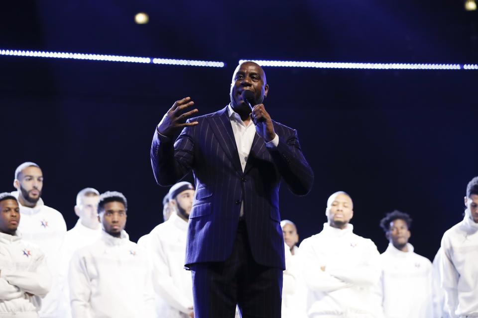 Magic Johnson speaks during a tribute to former NBA All-Star Kobe Bryant and his daughter Gianna who were killed in a helicopter crash on Jan. 26, 2020, before the NBA All-Star basketball game Sunday, Feb. 16, 2020, in Chicago. (AP Photo/Nam Huh)