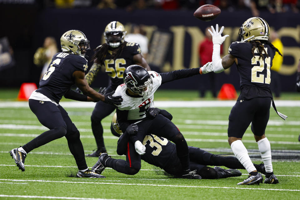 New Orleans Saints corner back Bradley Roby (21) catches a fumble by Atlanta Falcons wide receiver Drake London (5) in the second half of an NFL football game in New Orleans, Sunday, Dec. 18, 2022. (AP Photo/Butch Dill)