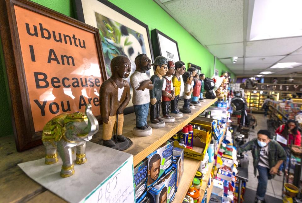 A view of claymation figures made by a local artist of store employees on the shelf