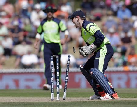 Ireland's Gary Wilson dismisses the West Indies' Darren Bravo (not pictured) during their Cricket World Cup match in Nelson, February 16, 2015. REUTERS/Anthony Phelps