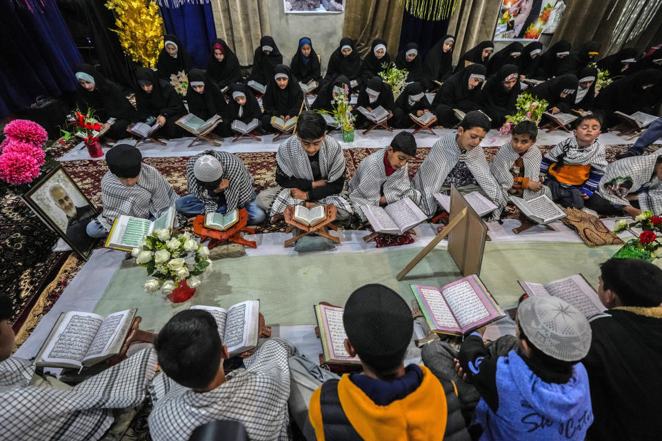 Shiite Muslim children attend recitation classes of the holy Quran during the fasting month of Ramadan in Srinagar, Indian controlled Kashmir, Thursday, March 28, 2024. Muslims across the world are observing Ramadan, during which they refrain from eating, drinking and smoking from dawn to dusk. (AP Photo/Mukhtar Khan)