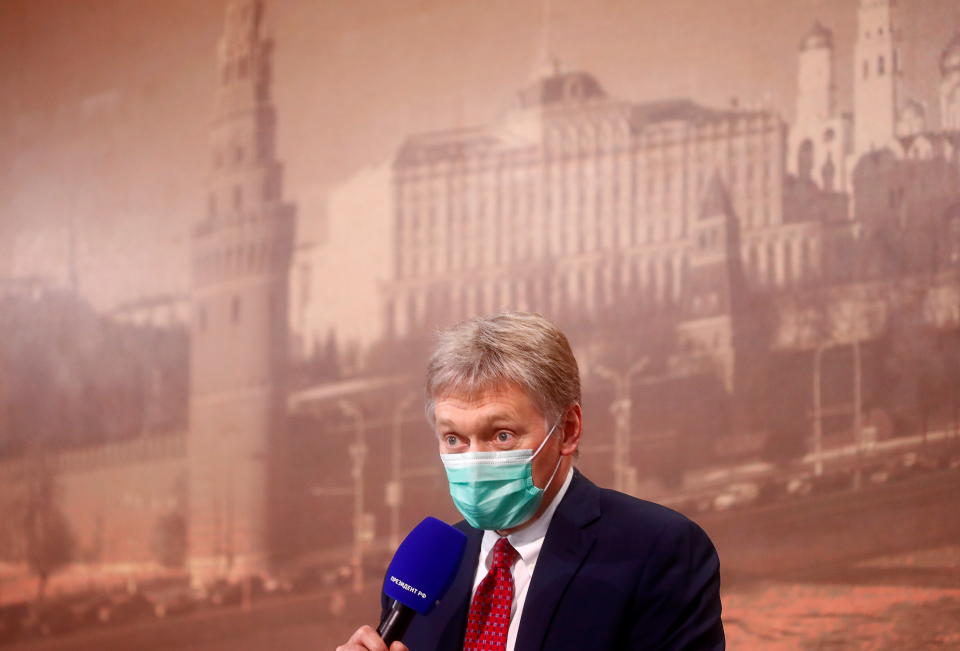 Kremlin spokesman Dmitry Peskov wearing a protective face mask attends Russian President Vladimir Putin's annual end-of-year news conference, held online in a video conference mode, in Moscow, Russia December 17, 2020. REUTERS/Maxim Shemetov