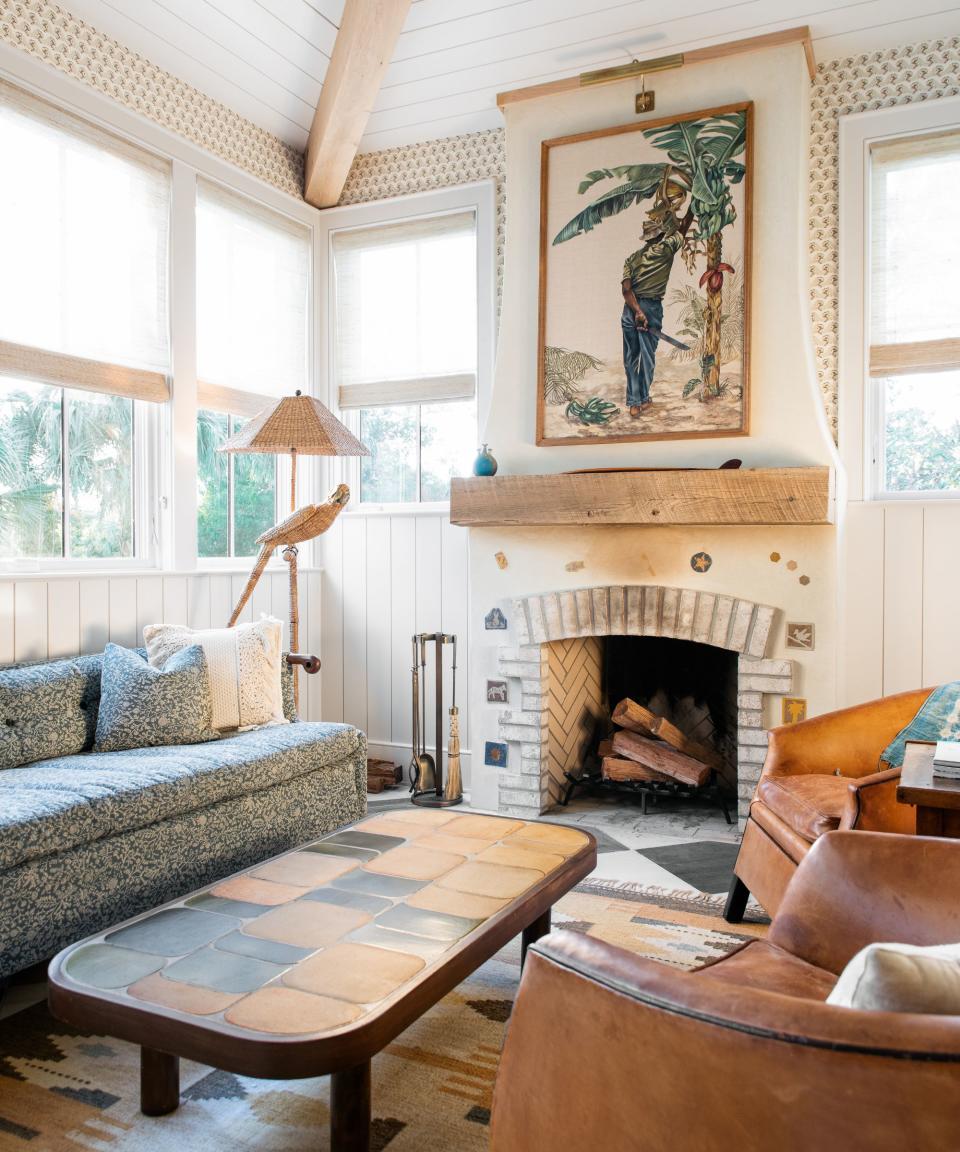 Living room with fireplace and artwork over it