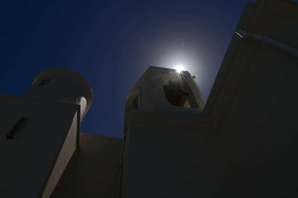 The midday sun rises over the facade of the second oldest Spanish church in the Americas, the San Jose Church, that will reopen following a massive reconstruction that took nearly two decades to complete, in San Juan, Puerto Rico, Tuesday, March 9, 2021. The church was built for a Dominican convent, served as a shelter during an attack by the Indigenous Taínos, became Puerto Rico’s first high school and was damaged by a cannonball during the 1898 Spanish-American War in which Spain ceded Puerto Rico to the U.S. (AP Photo/Carlos Giusti)