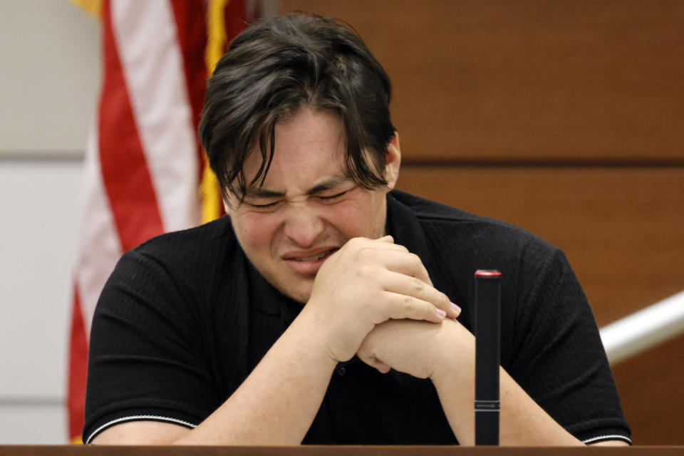 Former Marjory Stoneman Douglas High School student Kyle Laman, who was injured in the 2018 shootings, reacts as surveillance video of the massacre is played in court on the second day of testimony in the case of former MSD High School School Resource Officer Scot Peterson at the Broward County Courthouse in Fort Lauderdale on Thursday, June 8, 2023. Broward County prosecutors charged Peterson, a former Broward Sheriff's Office deputy, with criminal charges for failing to enter the 1200 Building at the school and confront the shooter as he perpetuated the Valentine's Day 2018 Massacre. (Amy Beth Bennett/South Florida Sun-Sentinel via AP, Pool)