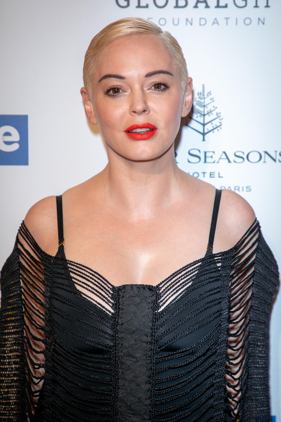 Rose McGowan posing at a gala