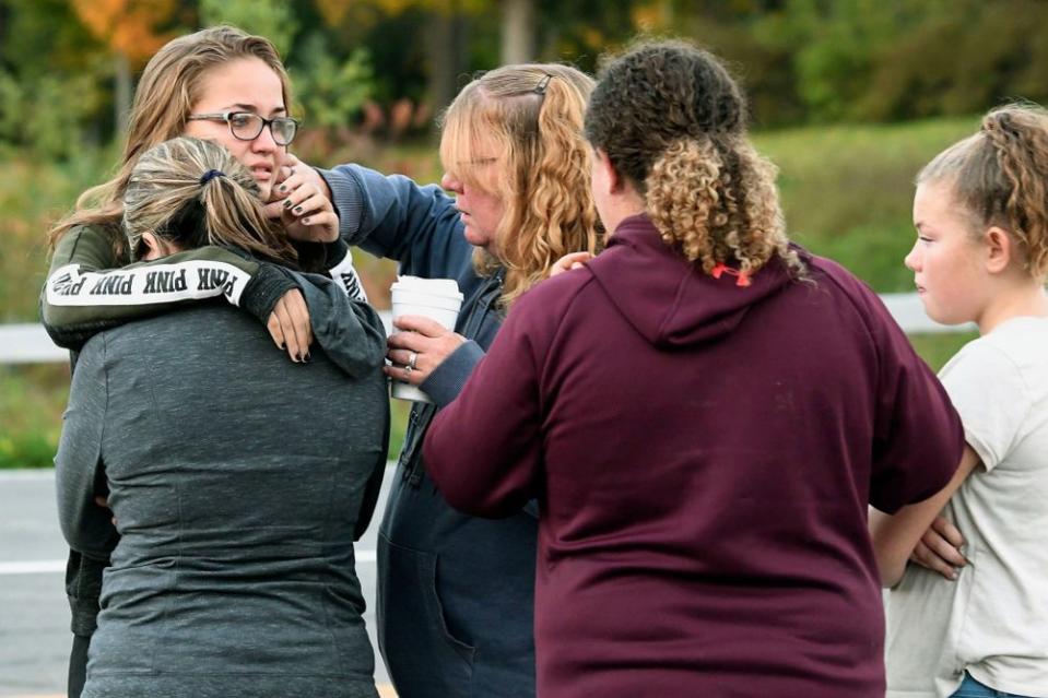 Mourners at the scene of the crash