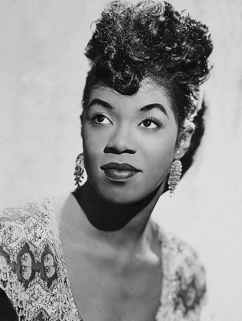 <p>An American jazz legend, Vaughan — a.k.a. "The Divine One" — achieved chart-topping success in 1949 with her hit, "Black Coffee."</p>