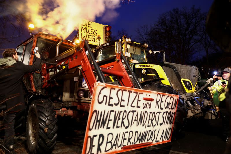German farmers prepare for a protest against the cut of farm vehicle tax subsidies in Berlin