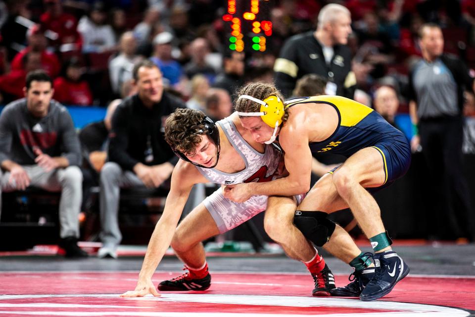 Michigan's Nick Suriano, right, wrestles Rutgers' Dylan Shawver at 125 pounds during the first session of the Big Ten Wrestling Championships, Saturday, March 5, 2022, at Pinnacle Bank Arena in Lincoln, Nebraska.