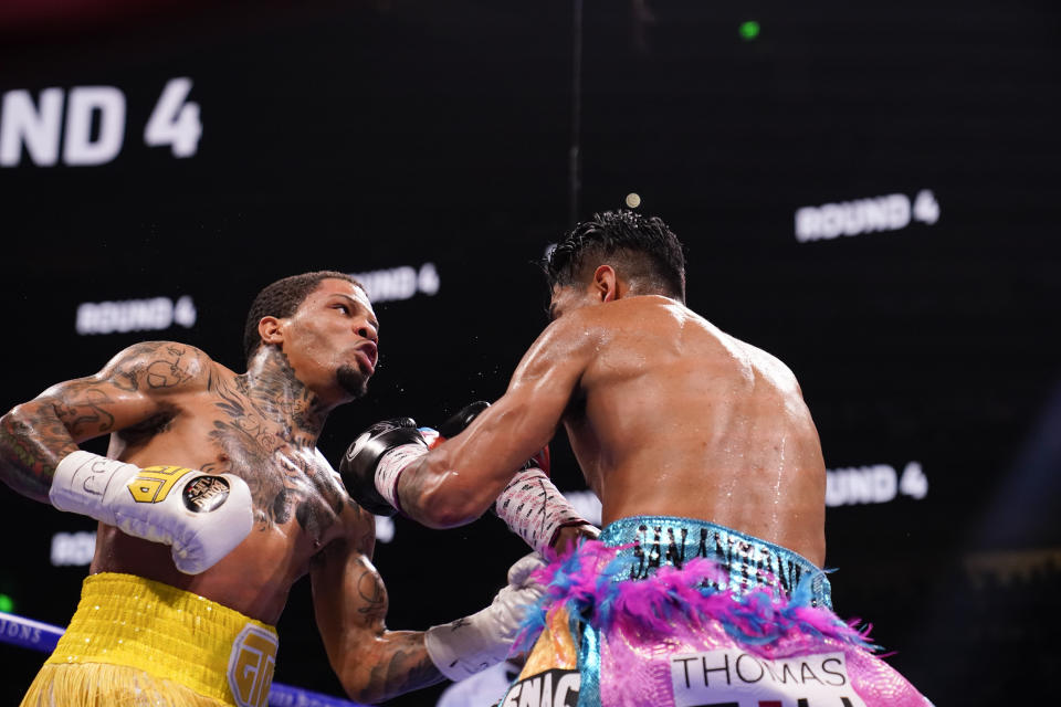 Gervonta Davis, left, hits Mario Barrios during the WBA Super Lightweight world championship boxing match on Saturday, June 26, 2021, in Atlanta. Davis won. (AP Photo/Brynn Anderson)