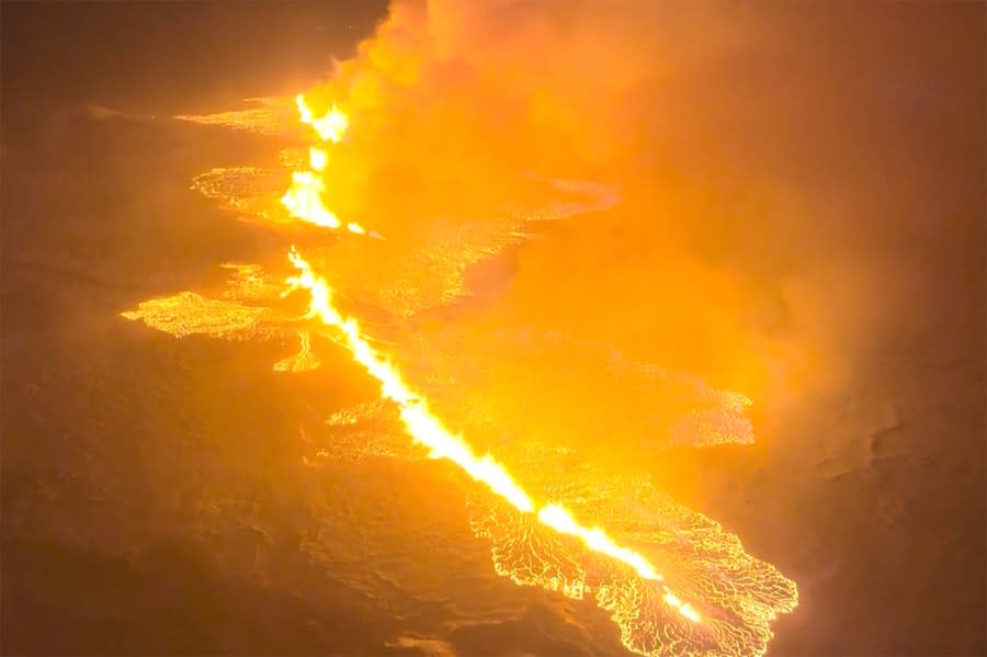 This image made from video provided by the Icelandic Coast Guard shows magma flow on a hill near Grindavik on Iceland’s Reykjanes Peninsula sometime around late Monday, Dec. 18, or early Tuesday, Dec. 19, 2023. A volcanic eruption started Monday night on Iceland’s Reykjanes Peninsula, turning the sky orange and prompting the country’s civil defense to be on high alert. (Icelandic coast guard via AP)