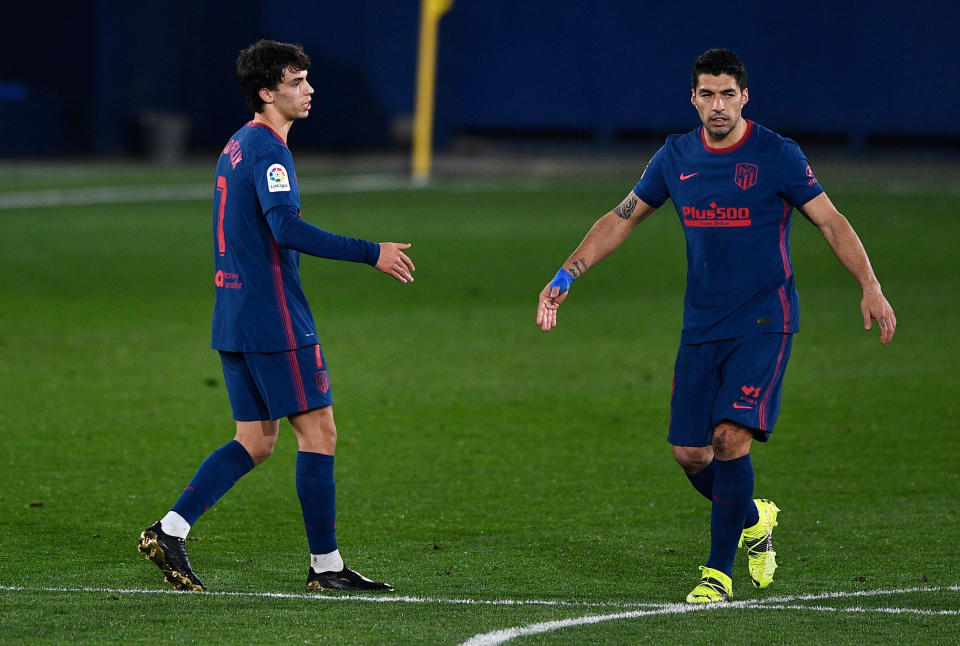 Soccer Football - La Liga Santander - Villarreal v Atletico Madrid - Estadio de la Ceramica, Villarreal, Spain - February 28, 2021 Atletico Madrid's Joao Felix celebrates scoring their second goal with Luis Suarez REUTERS/Pablo Morano