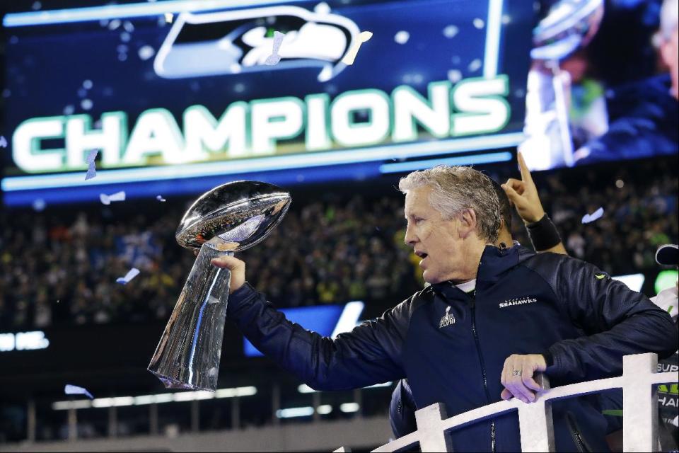 Seattle Seahawks head coach Pete Carroll holds the the Vince Lombardi Trophy after the NFL Super Bowl XLVIII football game against the Denver Broncos Sunday, Feb. 2, 2014, in East Rutherford, N.J. The Seahawks won 43-8. (AP Photo/Julio Cortez)