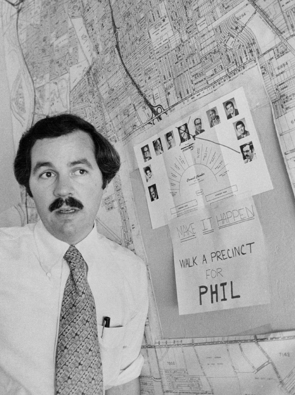 Sacramento City Councilman Phil Isenberg strategizes in August 1975 for his successful bid to replace Richard H. Marriott – whose photograph is crossed out in the background – as mayor.