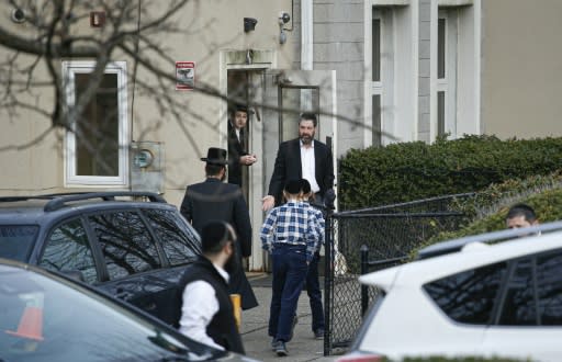 Members of the Jewish community leave a synagogue next to the home of rabbi, Chaim Rottenberg, in Monsey, New York on December 29, 2019 after a machete attack that took place the previous day