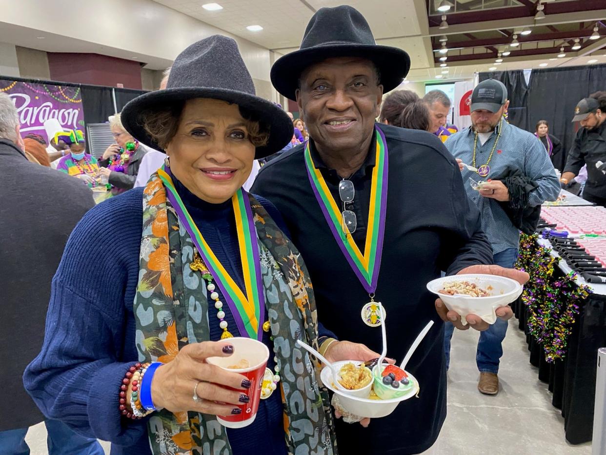 Former Pineville Mayor Clarence Fields and his wife Rosa enjoy foods from a previous Taste of Mardi Gras. The popular event will be held Friday, Feb. 17 at the Ned Randolph Riverfront Center.