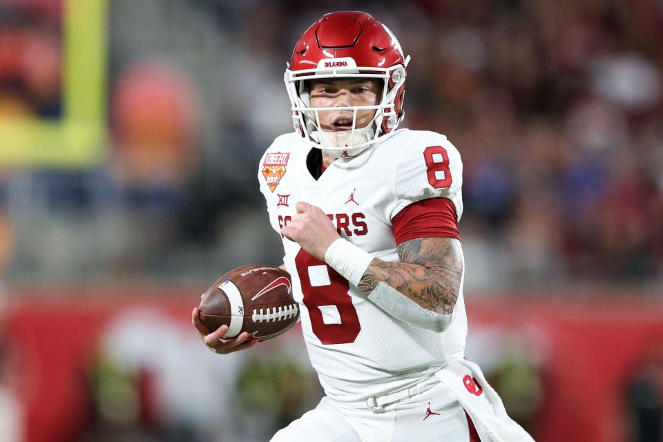 Dec 29, 2022; Orlando, Florida, USA;  Oklahoma Sooners quarterback Dillon Gabriel (8) runs with the ball against the Florida State Seminoles in the first quarter during the 2022 Cheez-It Bowl at Camping World Stadium. Mandatory Credit: Nathan Ray Seebeck-USA TODAY Sports