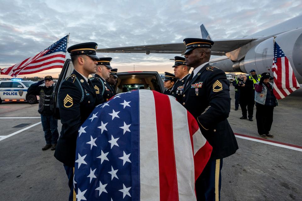 The remains of Lt. John Heffernan, a WW2 US bomber navigator who was shot down in Burma in 1944, arrive at Newark Liberty Airport on Tuesday November 15, 2022. Members of the Honor Guard load Heffernan's flag-draped coffin into the hearse. (Clockwise) Sgs. Arca, Sfc. Pariona, Sfc. Williams, Ssg. Rodriguez, Msg. Hall and Sgt. Laurore.