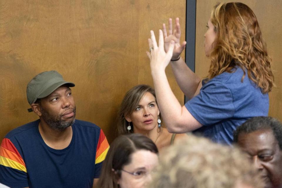 Ta-Nehisi Coates and Mary Wood, a teacher at Chapin High School, speak with Wood’s supporters before a meeting of the Lexington-Rchland 5 school board on Monday, July 17, 2023.