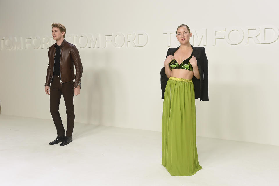 Kate Hudson, right, and Joe Alwyn attend the Tom Ford show at Milk Studios during NYFW Fall/Winter 2020 on Friday, Feb. 7, 2020, in Los Angeles. (Photo by Jordan Strauss/Invision/AP)