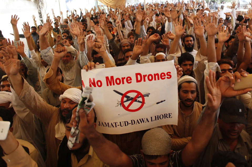 <p>Supporters of Pakistani religious group Jamaat-ud-Dawa protest against the U.S. drone strike in Pakistani territory which killed Taliban leader Mullah Mansour, May 27, 2016, in Lahore, Pakistan. Nation-wide protests were held in Pakistan to condemn the drone attack on Pakistani soil. (AP Photo/K.M. Chaudary) </p>