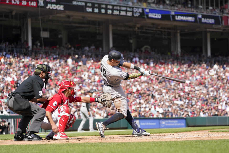 New York Yankees' Aaron Judge (99) hits a one-run single against the Cincinnati Reds in the third inning of a baseball game in Cincinnati, Saturday, May 20, 2023. (AP Photo/Jeff Dean)