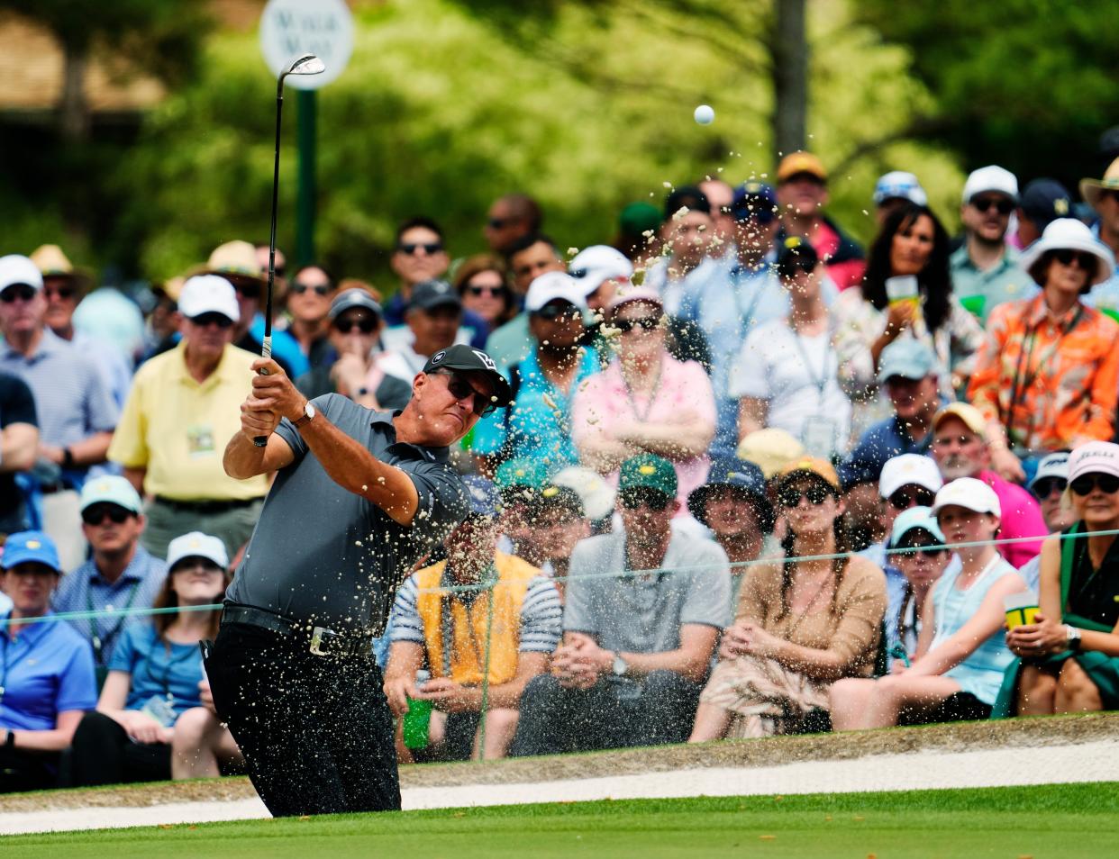 Phil Mickelson hits out of a bunker on No. 7 during the first round of the Masters Tournament in Augusta, Georgia, on April 11, 2024.