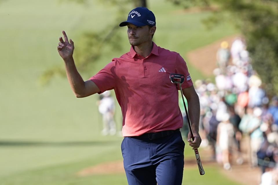 Nicolai Hojgaard, of Denmark, waves after making a putt on the 10th hole during third round at the Masters golf tournament at Augusta National Golf Club Saturday, April 13, 2024, in Augusta, Ga. (AP Photo/George Walker IV)