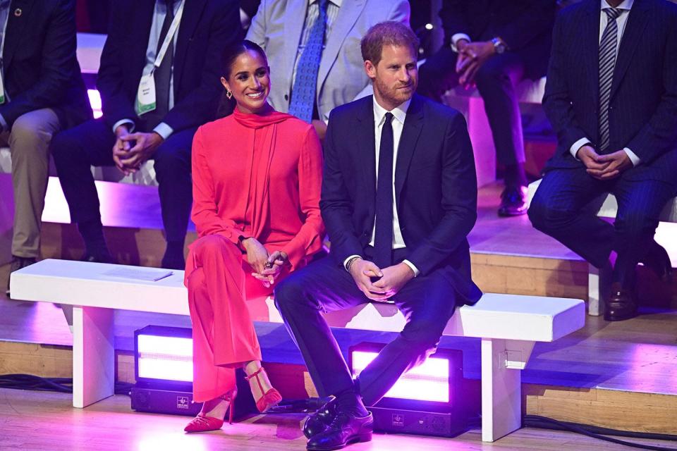 MANCHESTER, ENGLAND - SEPTEMBER 05: Meghan, Duchess of Sussex, Prince Harry, Duke of Sussex and Cofounder of One Young World, Kate Robertson on stage during the Opening Ceremony of the One Young World Summit 2022 at The Bridgewater Hall on September 05, 2022 in Manchester, England. The annual One Young World Summit brings together more than two thousand of the brightest young leaders from every country and sector, working to accelerate social impact both in-person and digitally. Meghan is a counsellor for the organisation, alongside Justin Trudeau, Sir Richard Branson, and Jamie Oliver, among others. (Photo by Chris Jackson/Getty Images)