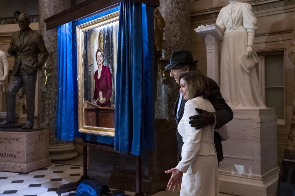 Speaker of the House Nancy Pelosi, D-Calif., is joined by her husband Paul Pelosi as they attend her portrait unveiling ceremony in Statuary Hall at the Capitol in Washington, Wednesday, Dec. 14, 2022. (AP Photo/J. Scott Applewhite)