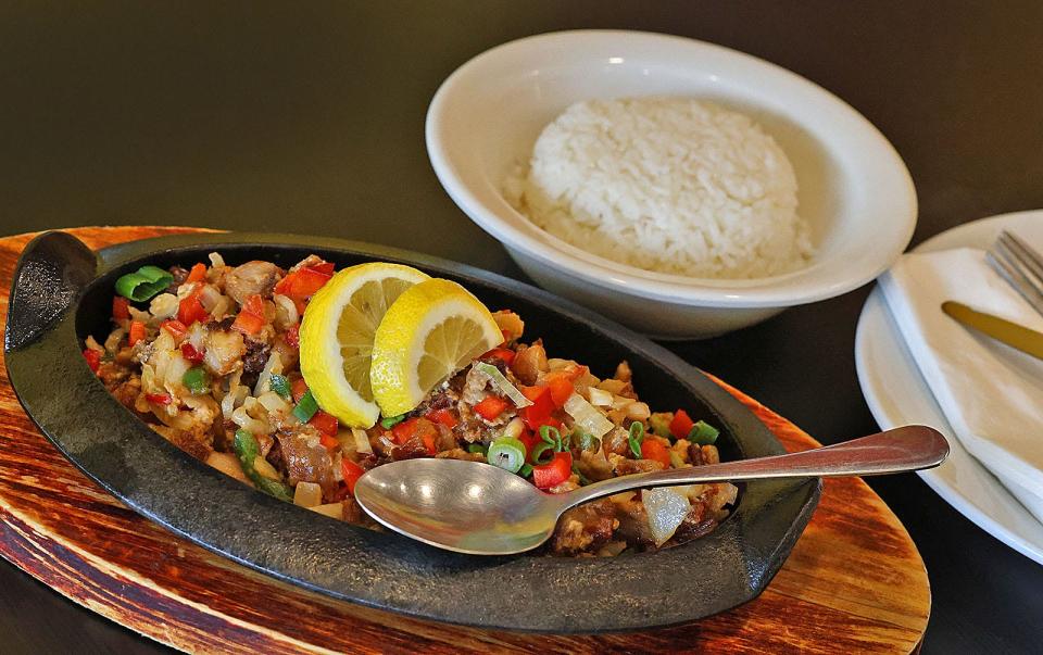 Lechon kawali, a popular Filipino dish with crispy deep-fried pork belly, is one of the offerings from Bright Light Authentic Jamaican & Filipino Cuisine on Water Street in Quincy.