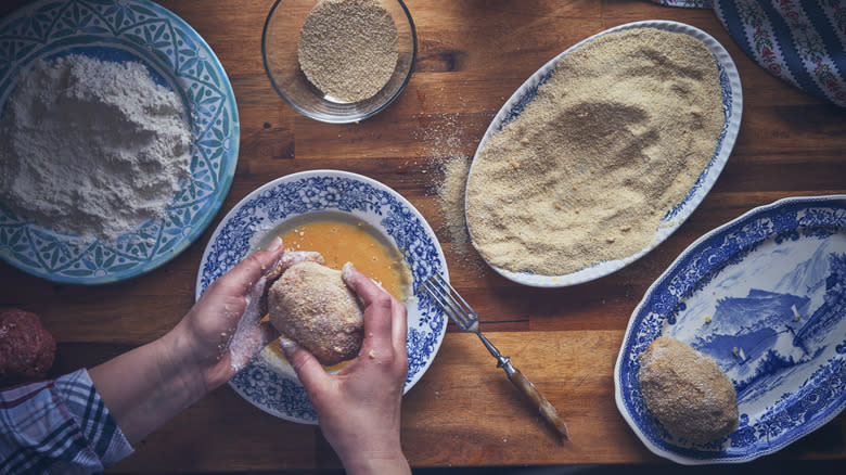 Scotch eggs being prepared