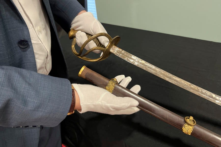 Adam Fleischer, President of Fleischer’s Auctions, holds Civil War Union Gen. William Tecumseh Sherman’s sword and scabbard, Thursday, May 9, 2024, in Columbus, Ohio. The wartime sword, likely used between 1861 and 1863, are among the items that will be open to bidders Tuesday, May 14, 2024, at Fleischer’s Auctions. (AP Photo/Patrick Orsagos)