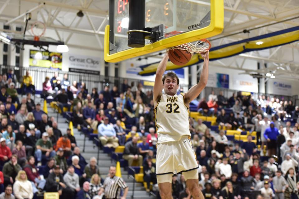 Port Huron Northern's Tyler Jamison dunks the ball during a game earlier this season. Starting in the fall, Jamison will continue his career at Fairleigh Dickinson University.