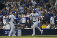 Los Angeles Dodgers' Will Smith (16) celebrates with third base coach Dino Ebel after hitting a home run during the eighth inning of the team's baseball game against the San Diego Padres, Thursday, Sept. 29, 2022, in San Diego. (AP Photo/Gregory Bull)