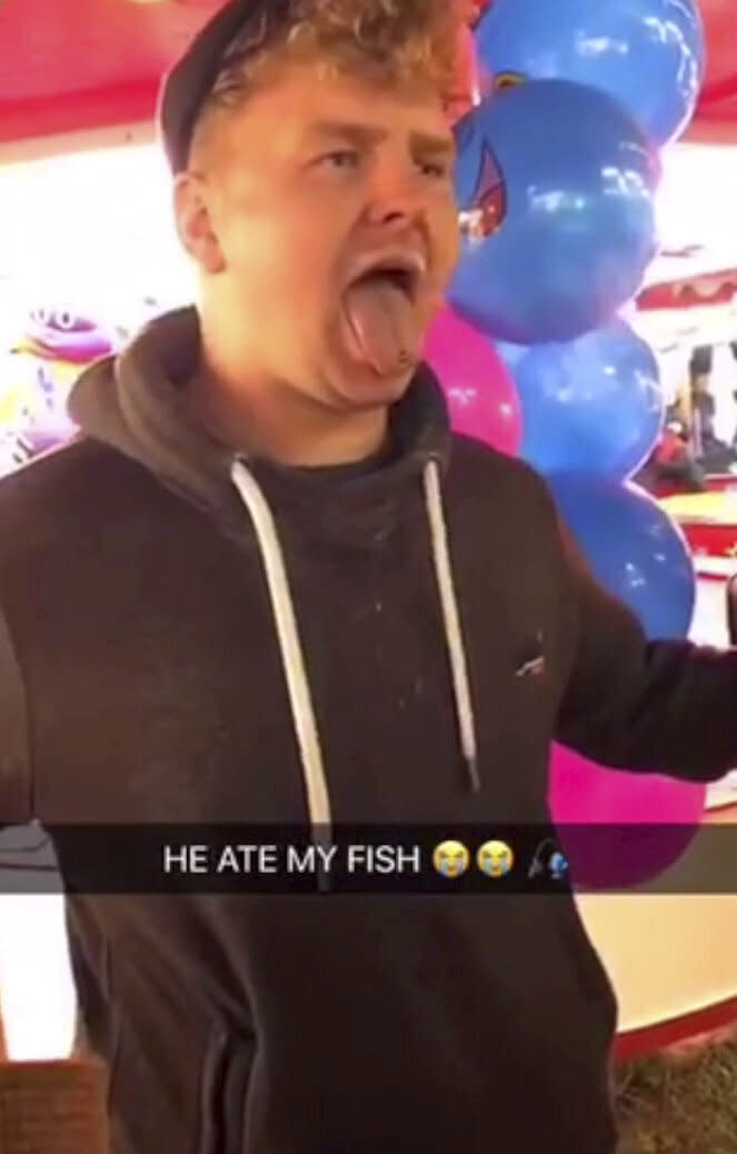 Joshua Coles, 27, of Tiverton, Devon, was filmed swallowing a goldfish which had been won at Bridgwater Fair last year. He was fined £300 and banned from keeping fish for five years. The fair has confirmed it will no longer offer fish as prizes. (SWNS)