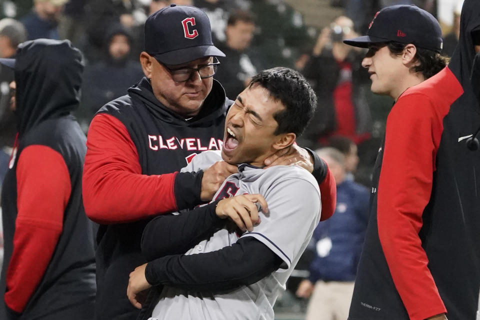 Cleveland Guardians manager Terry Francona, left, and left fielder Steven Kwan celebrate the team's win against the Chicago White Sox in a baseball game Thursday, Sept. 22, 2022, in Chicago. (AP Photo/David Banks)