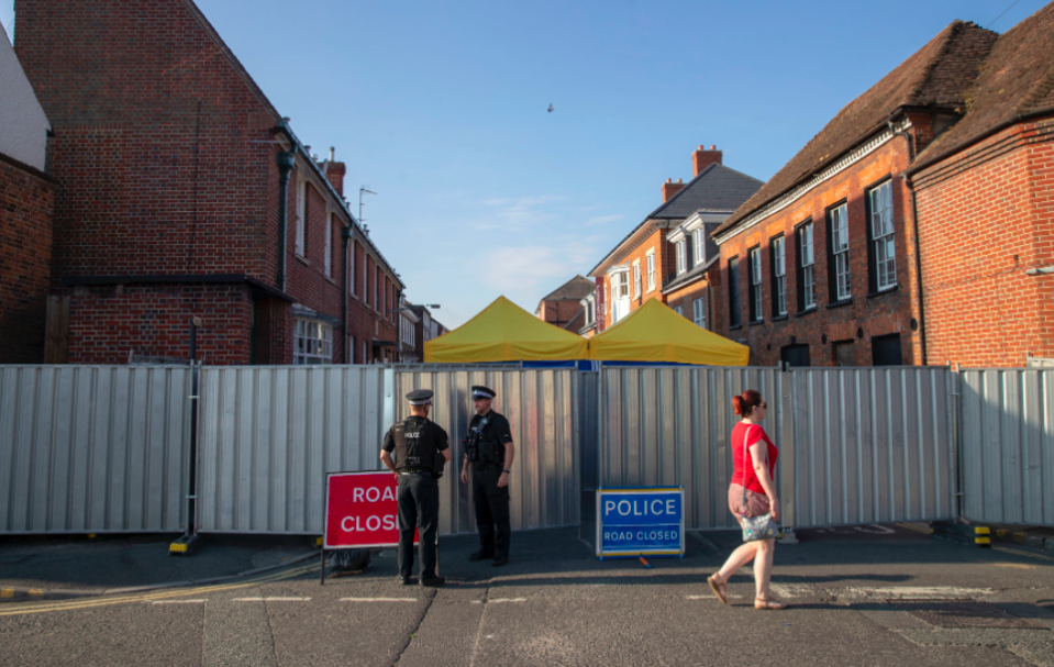 <em>Police remain at the scene in Rollestone Street, Salisbury, where counter-terrorism officers are investigating following the death of Ms Sturgess (PA)</em>